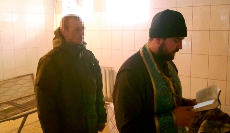 С крестом  на бронежилете